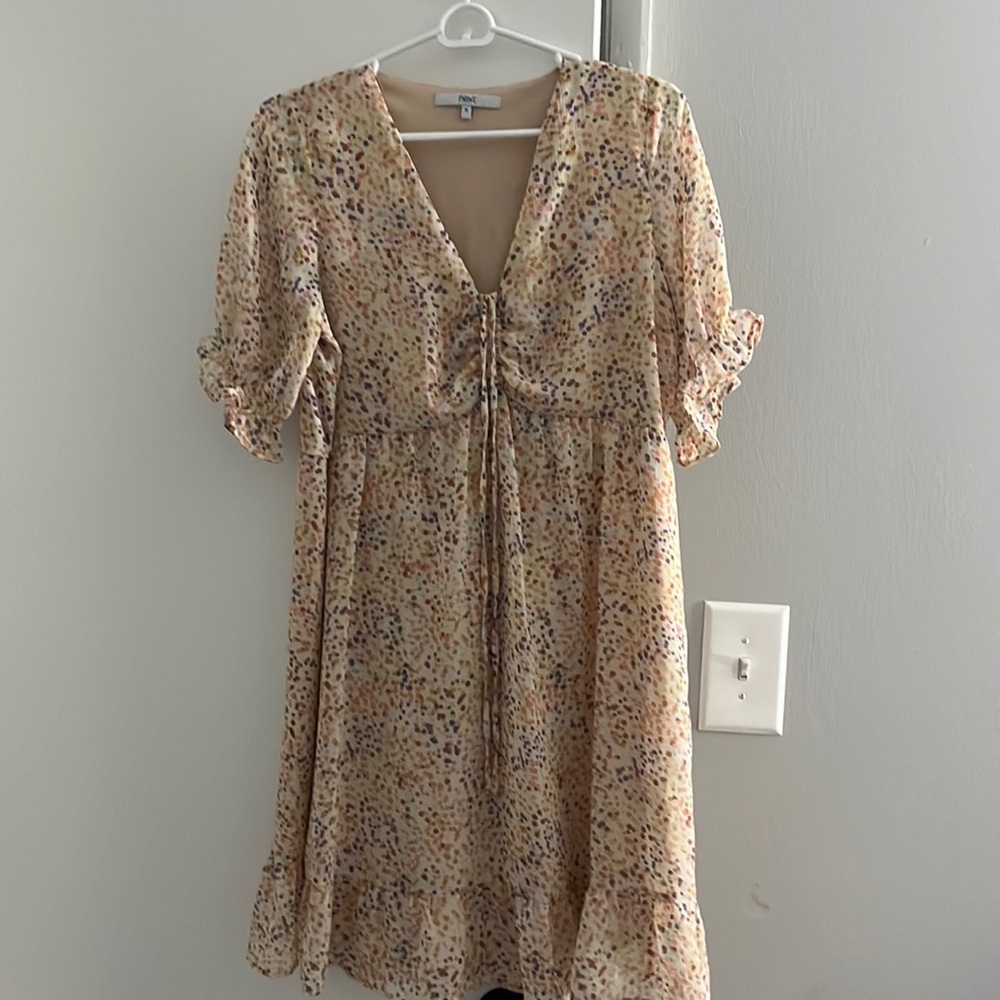 Colorful dot dress with ruffle sleeve at bottom and drawstring chest